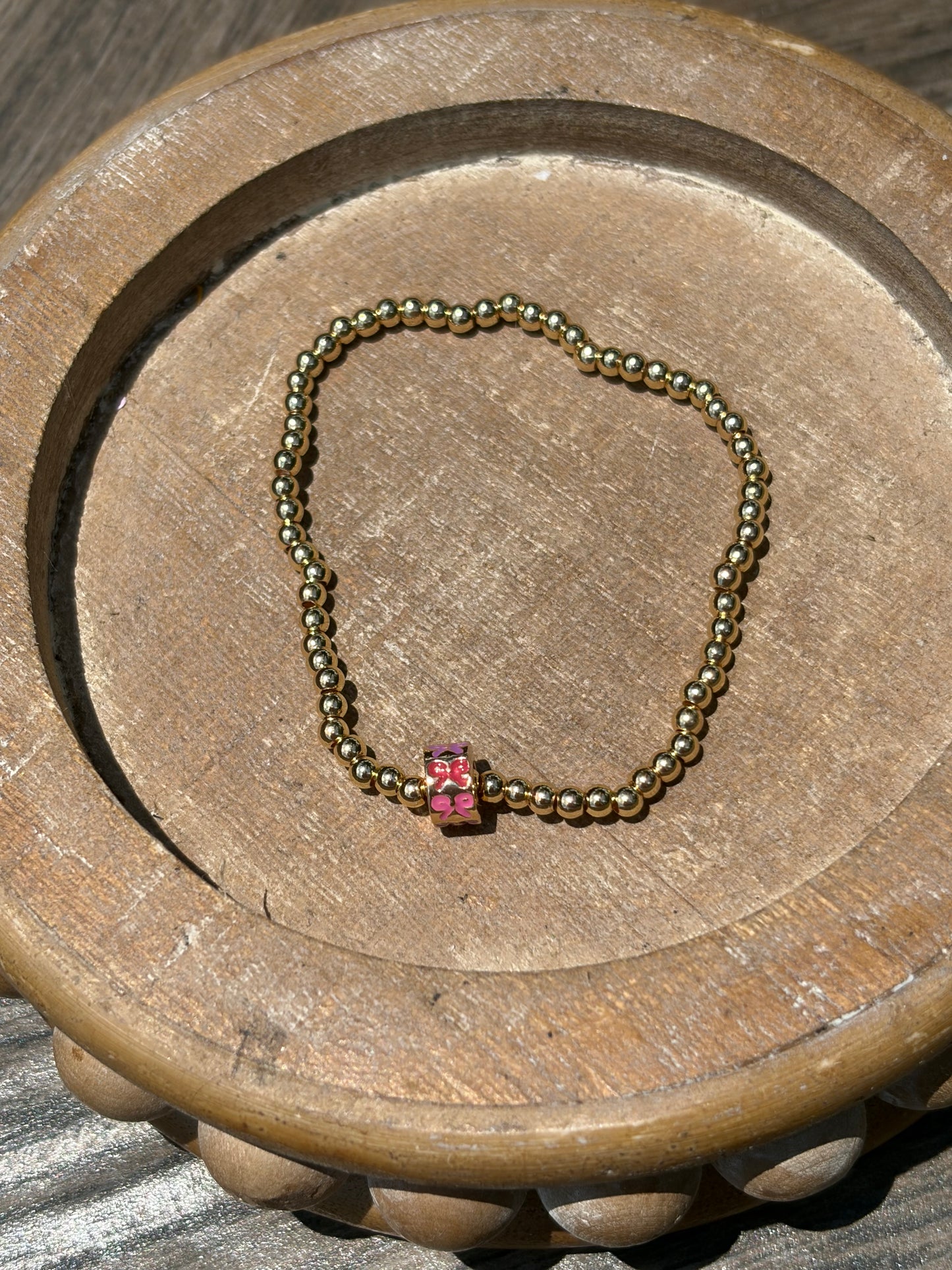 Gold with charm