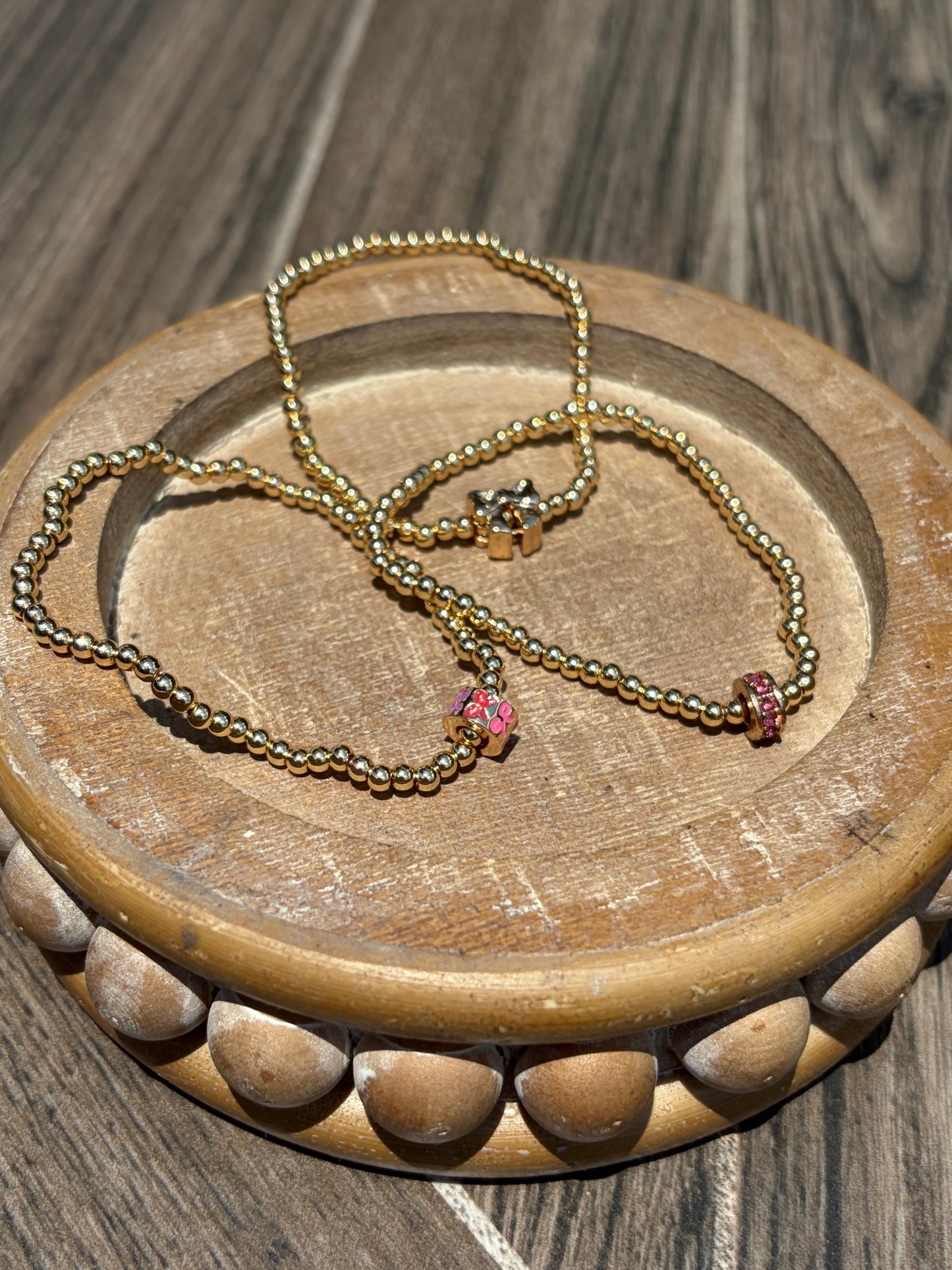 Gold with charm